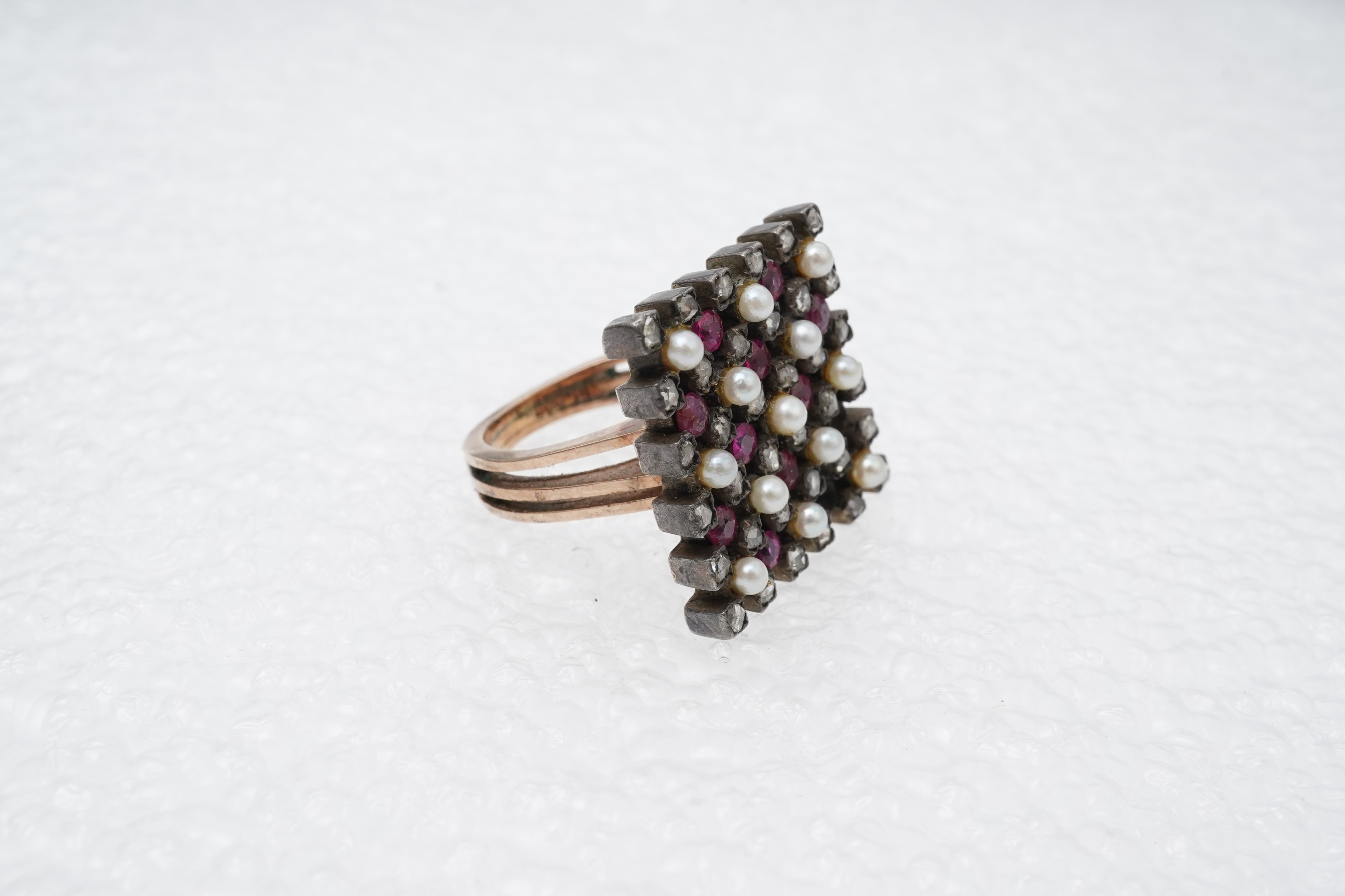 A synthetic ruby, seed pearl and diamond ring